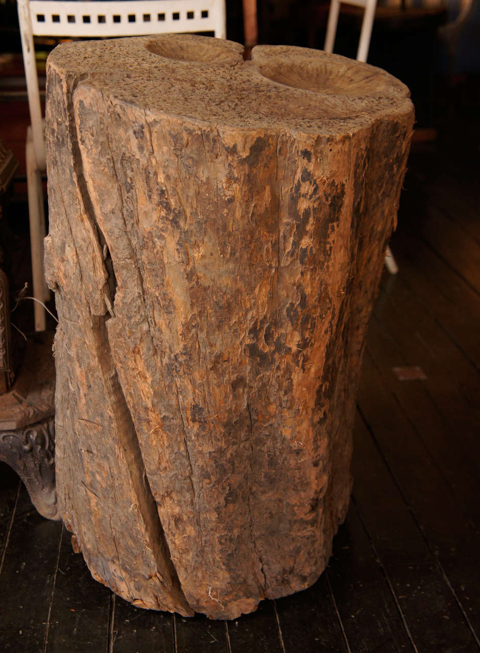 Rare, early American work bench, carved from a single Cherry tree log. The top surface careful sculpted for hammering and rounding tin and other metals. Found in a NY state home that remained in one family for over 200 years.  Rather magical.